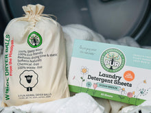 Load image into Gallery viewer, canvas bag that reads wool dryer balls from the himalayas with benefits and a rectangular box that reads PUR EVERGREEN Laundry Detergent Sheets Ocean Breeze scented