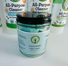 Load image into Gallery viewer, close up of clear jar with black lid, label reads Eucalyptus menthol shower steamers