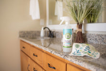 Load image into Gallery viewer, spray bottle of sassy spearmint all purpose cleaner and Swedish dishcloth on a bathroom counter