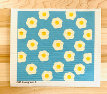 Load image into Gallery viewer, An eco-friendly Swedish dishcloth made from a blend of cotton and cellulose, with a textured surface for easy cleaning and scrubbing. The cloth is thin yet durable, and can be easily wrung out to remove excess water. It is shown in a variety of colors and patterns, with a label that reads 'Swedish Dishcloth