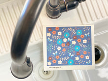 Load image into Gallery viewer, An eco-friendly Swedish dishcloth made from a blend of cotton and cellulose, with a textured surface for easy cleaning and scrubbing. The cloth is thin yet durable, and can be easily wrung out to remove excess water. It is shown in a variety of colors and patterns, with a label that reads 'Swedish Dishcloth