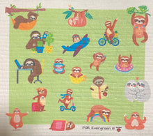Load image into Gallery viewer, An eco-friendly Swedish dishcloth made from a blend of cotton and cellulose, with a textured surface for easy cleaning and scrubbing. The cloth is thin yet durable, and can be easily wrung out to remove excess water. It is shown in a variety of colors and patterns, with a label that reads 'Swedish Dishcloth