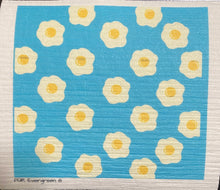 Load image into Gallery viewer, An eco-friendly Swedish dishcloth made from a blend of cotton and cellulose, with a textured surface for easy cleaning and scrubbing. The cloth is thin yet durable, and can be easily wrung out to remove excess water. It is shown in a variety of colors and patterns, with a label that reads 'Swedish Dishcloth