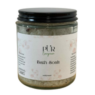 Jar of bath soak with a label on a white background