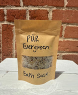 3.5 oz Bath soak in paper packaging. Ingredients include mix of sea salts, coconut oil, rosehip oil, coco butter, apricot oil, fankincense oil, lavendar oil, rose petals, chamomile flowers, and lavendar flowers. This soothing mix is perfect for bath time relaxation. 