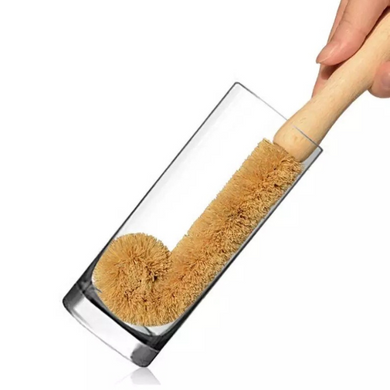 bamboo bottle brush inside a glass 