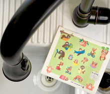 Load image into Gallery viewer, An eco-friendly Swedish dishcloth made from a blend of cotton and cellulose, with a textured surface for easy cleaning and scrubbing. The cloth is thin yet durable, and can be easily wrung out to remove excess water. It is shown in a variety of colors and patterns, with a label that reads &#39;Swedish Dishcloth